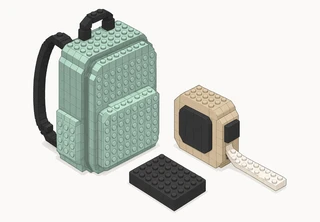A small sage daypack next to a tan tape measure with its tape pulled out, and a flat charcoal rectangular block.